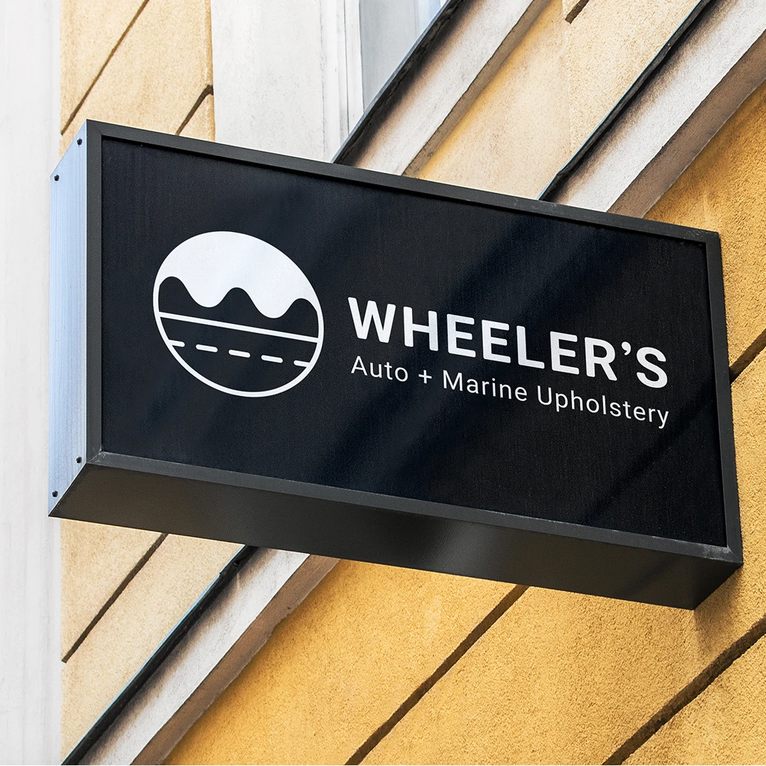 Wheeler's Auto And Marine Upholstery Building Sign